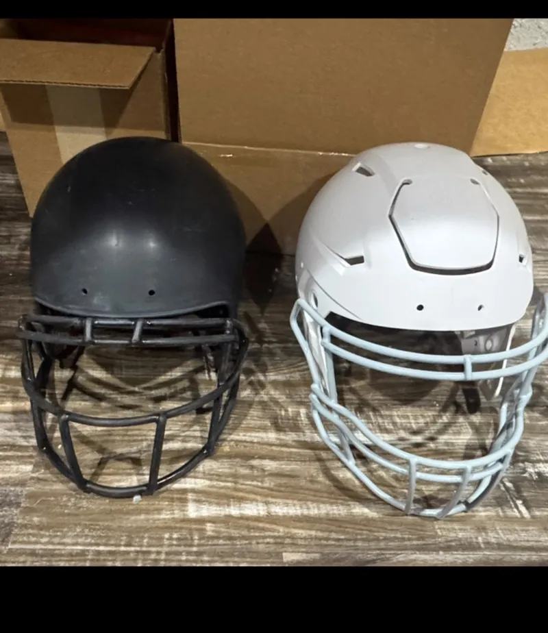 Football helmets in the shop ahead of custom paint work