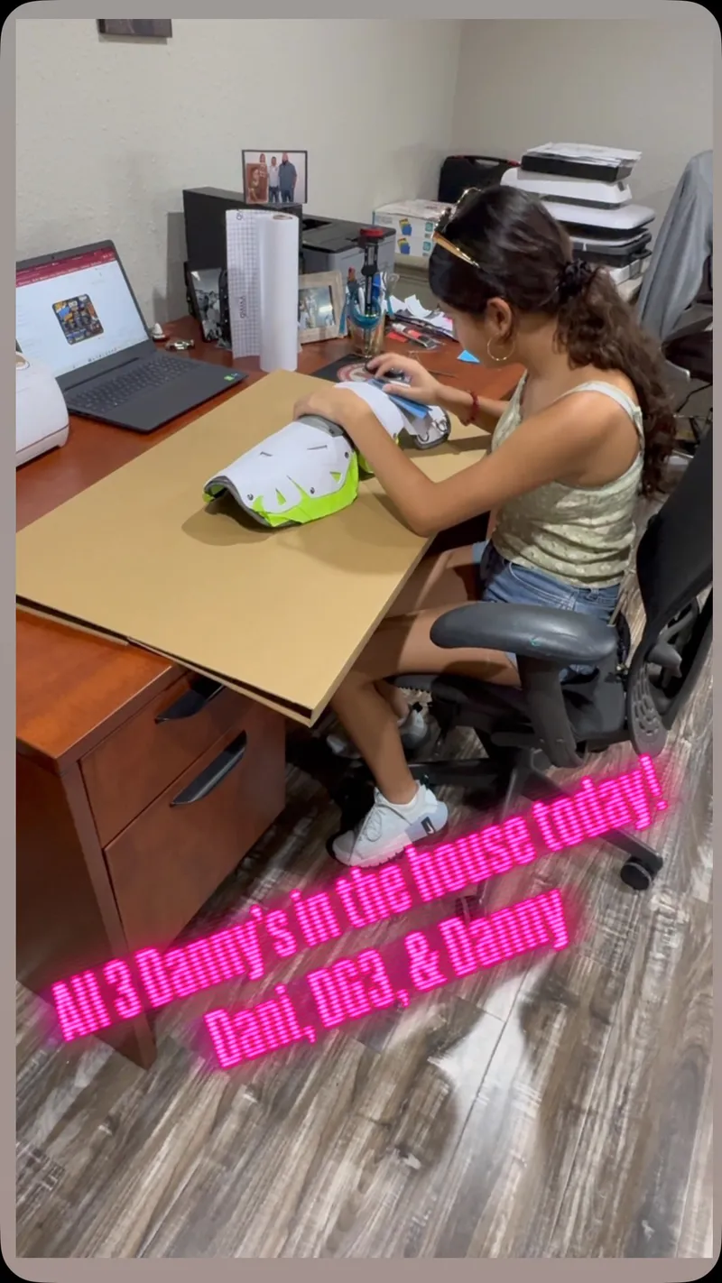 Inside the DG3 shop — family working on gear at the desk